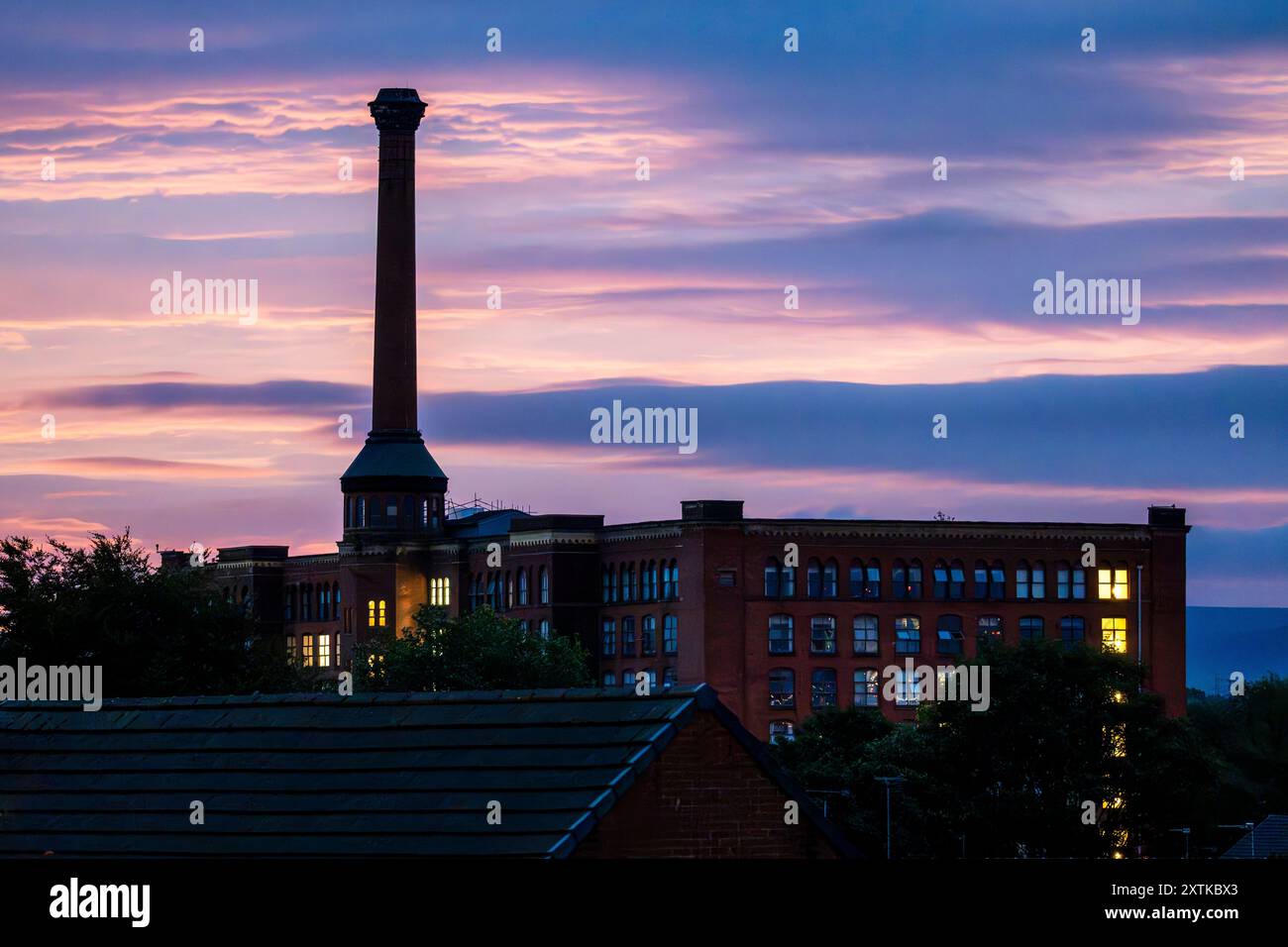 Sunrise over Victoria Mills in Miles Platting - Manchester. Stock Photo