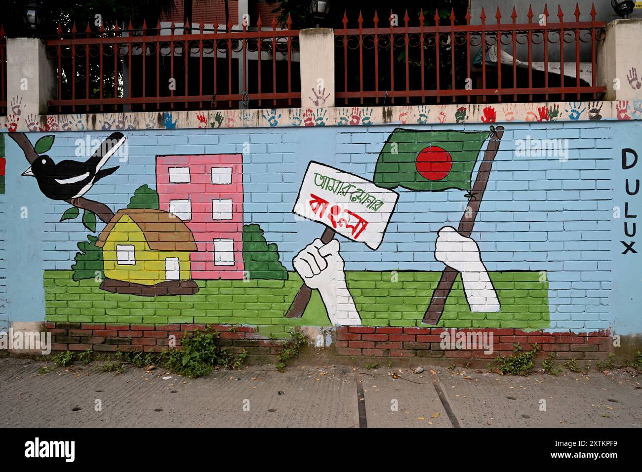 A view of Students paint graffiti on a wall alongside a road to express