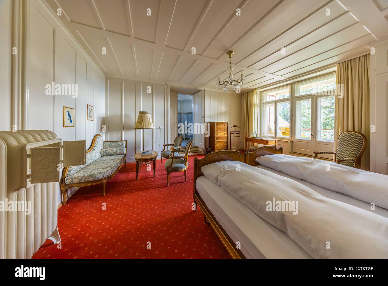 The German Emperor Wilhelm II had permanently reserved three rooms on the Schatzalp in Davos (today's Imperial Rooms 101, 201 and 301). The reason for this was that these rooms were to be available in the event that one of his family members fell ill with tuberculosis and needed treatment. The room permanently rented by the German Kaiser Wilhelm in the former Schatzalp sanatorium above Davos. Today it is a hotel. Bobbahnstrasse, Davos, Grisons, Grisons, Switzerland Stock Photo