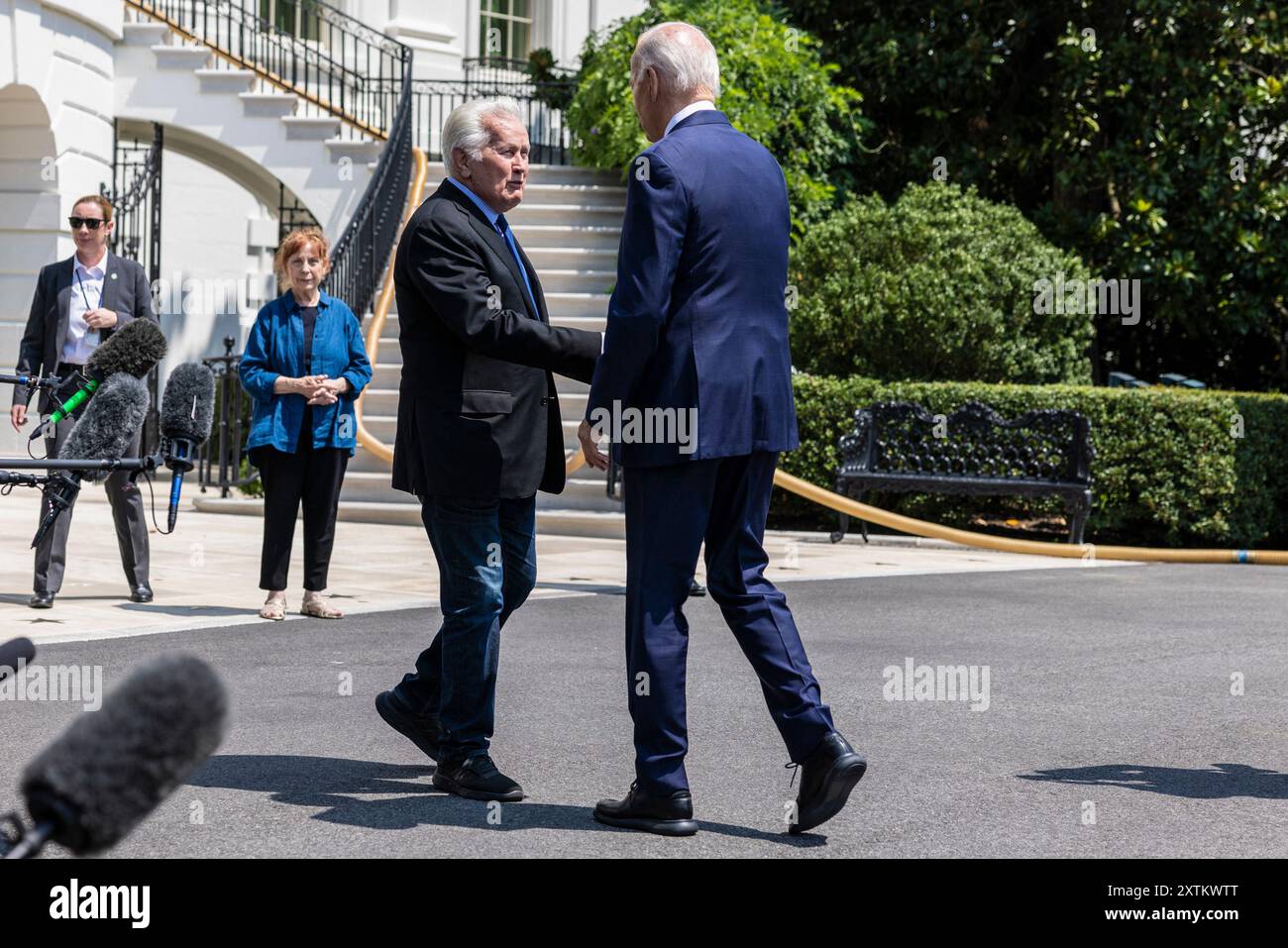 US President Joe Biden, right, shakes hands with actor Martin Sheen before boarding Marine One in Washington, DC, US, on Thursday, Aug. 15, 2024. Biden will return to the campaign trail navigating a strange, bittersweet dynamic: how to transition from incumbent presidential nominee to hype man for Vice President Kamala Harris. Photo by Anna Rose Layden/Pool/ABACAPRESS.COM Credit: Abaca Press/Alamy Live News Stock Photo