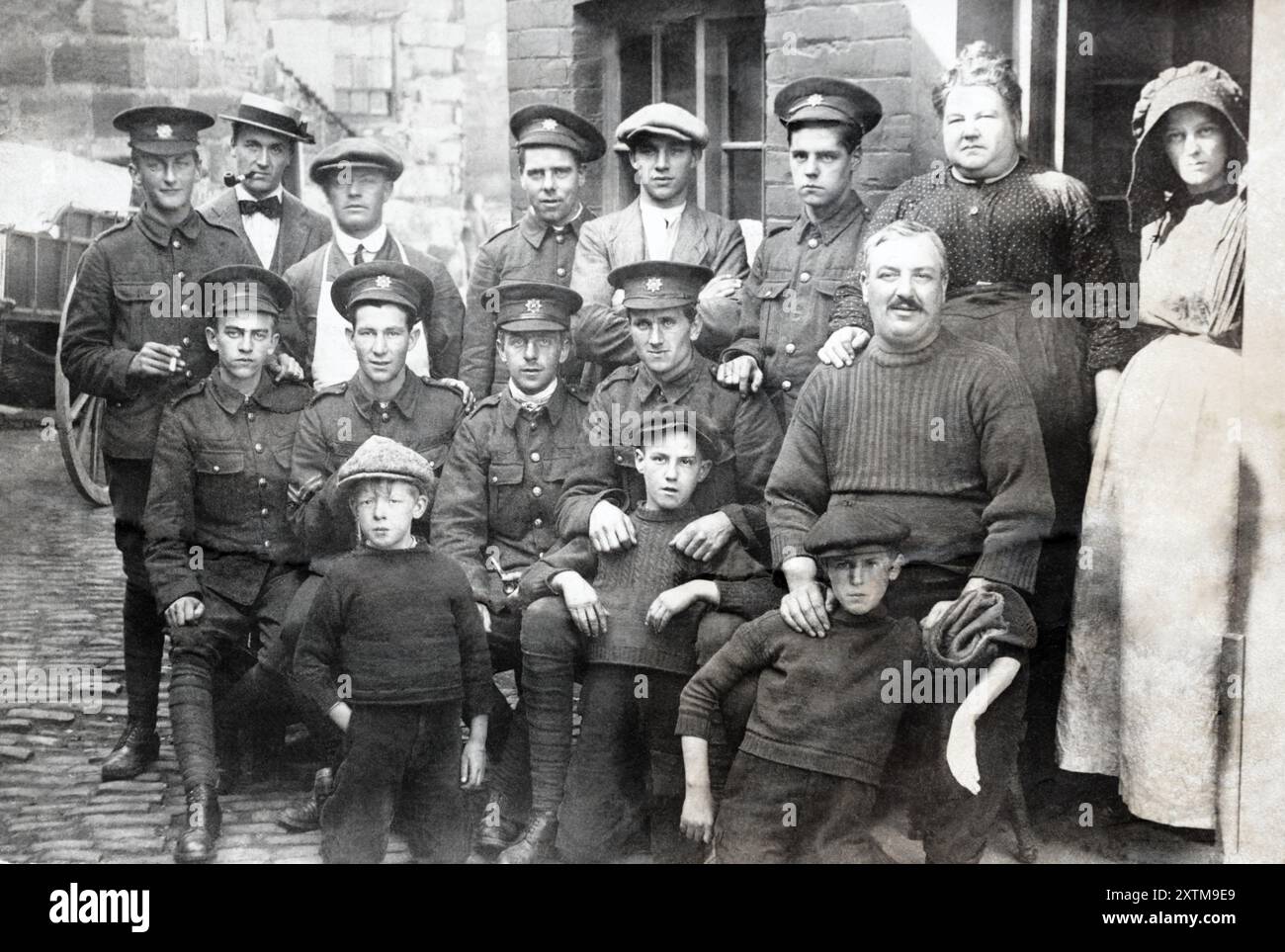 Men of the Devonshire Regiment alongside civilians during the First World War. Stock Photo