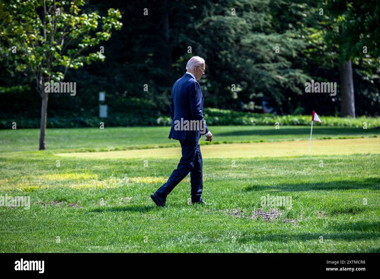 US President Joe Biden walks on the South Lawn of the White House after arriving on Marine One in Washington, DC, US, on Thursday, Aug. 15, 2024. Biden returned to the campaign trail navigating a strange, bittersweet dynamic: how to transition from incumbent presidential nominee to hype man for Vice President Kamala Harris. Photographer: Anna Rose Layden/Pool/Sipa USA Credit: Sipa USA/Alamy Live News Stock Photo