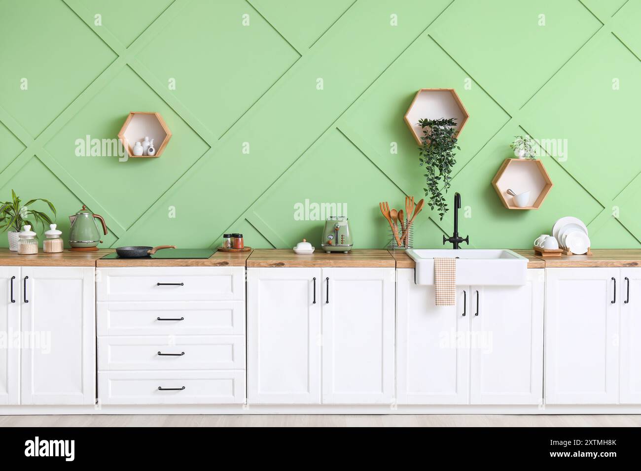 Interior of modern kitchen with stylish counter, stove and sink Stock ...