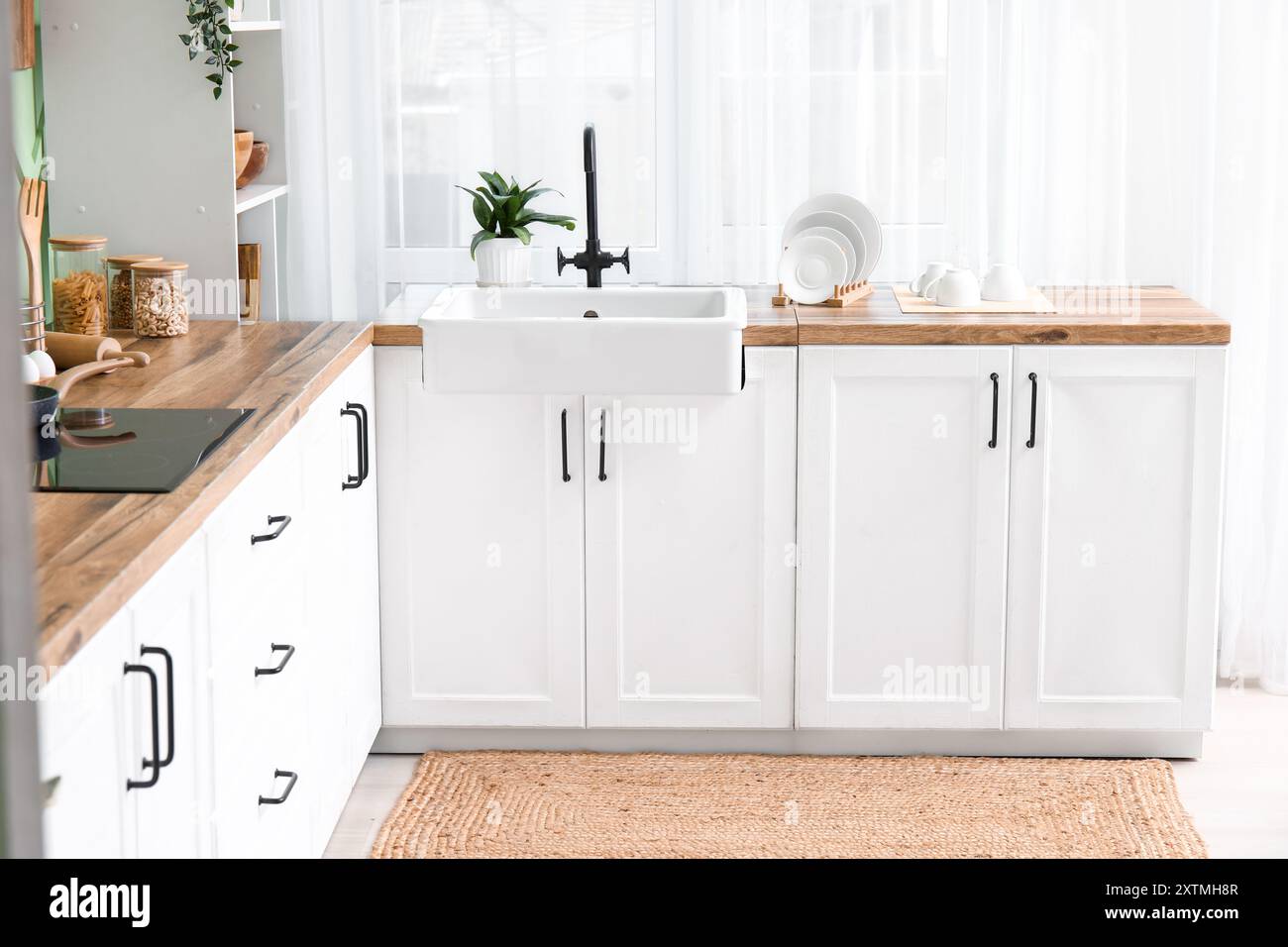 Interior of modern kitchen with stylish sink and kitchenware Stock ...