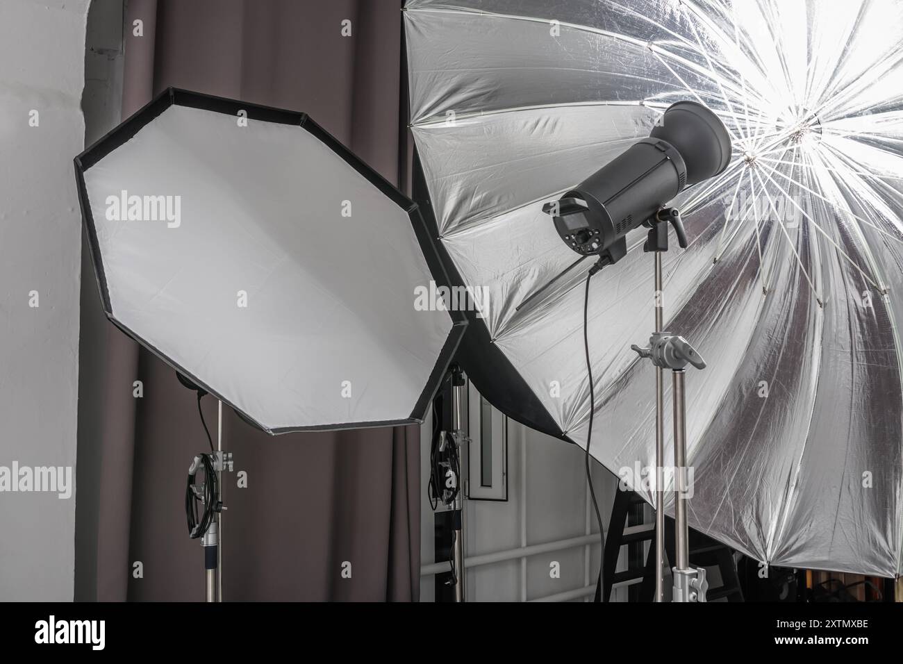 interior of bright space of photo studio with large white cyclorama with lighting equipment Stock Photo