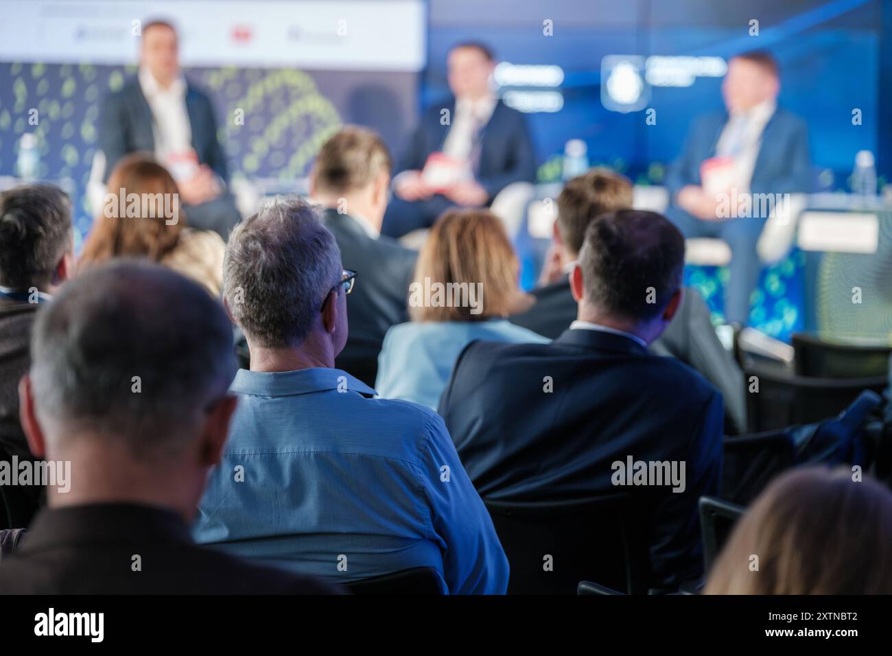 Conference audience viewing panel discussion hi-res stock photography ...