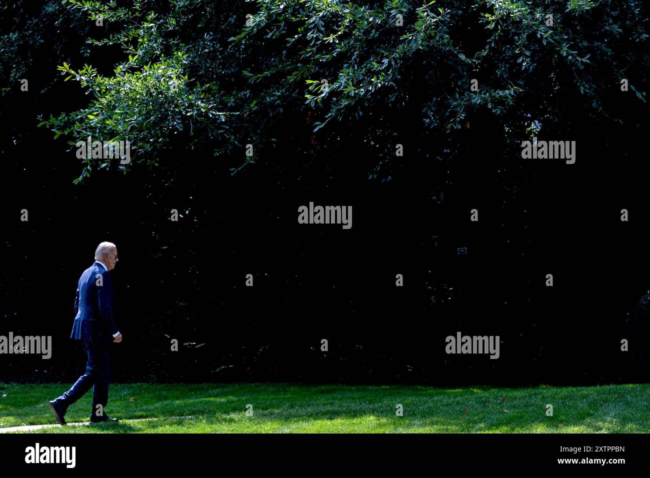 Washington, United States. 15th Aug, 2024. US President Joe Biden walks on the South Lawn of the White House after arriving on Marine One in Washington, DC on Thursday, August 15, 2024. Biden will returned to the campaign trail stumping for Vice President Kamala Harris. Photo by Anna Rose Layden/UPI Credit: UPI/Alamy Live News Stock Photo