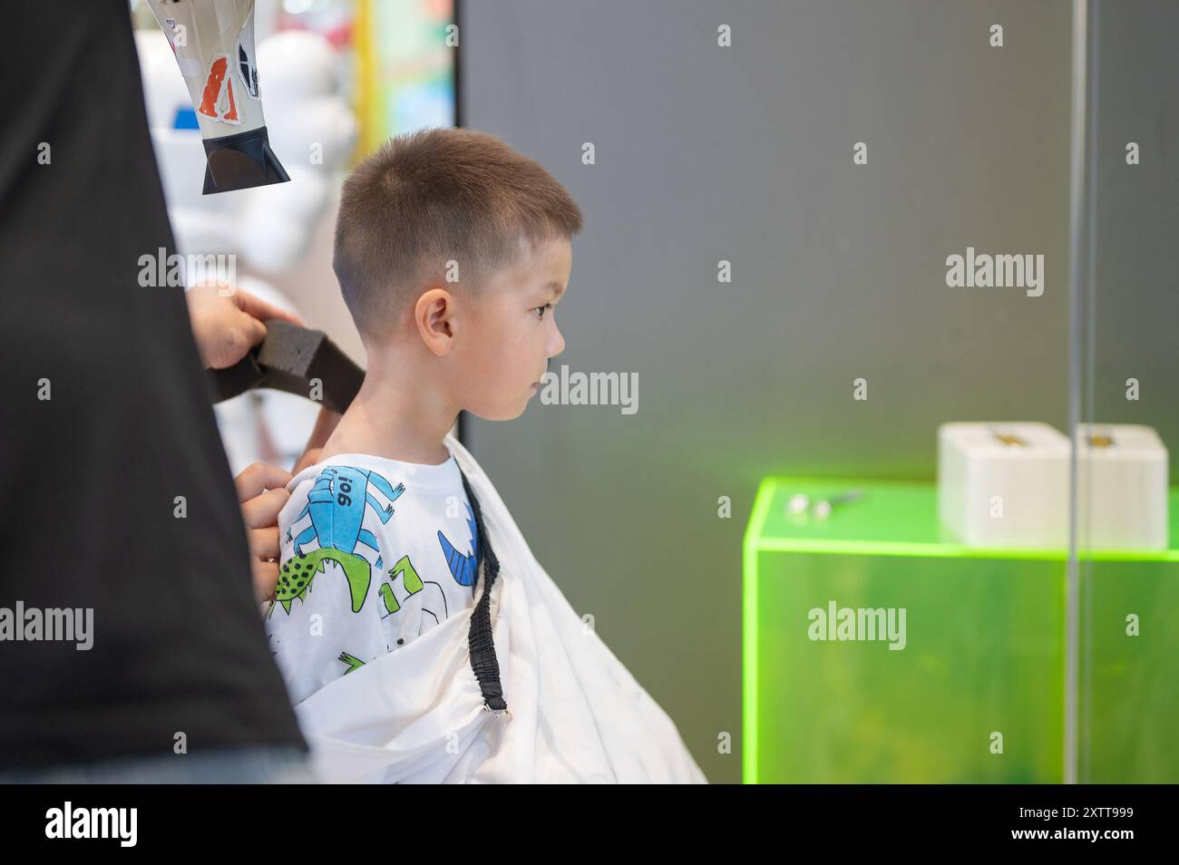 Captured is a child receiving the final touches and clean-up after ...