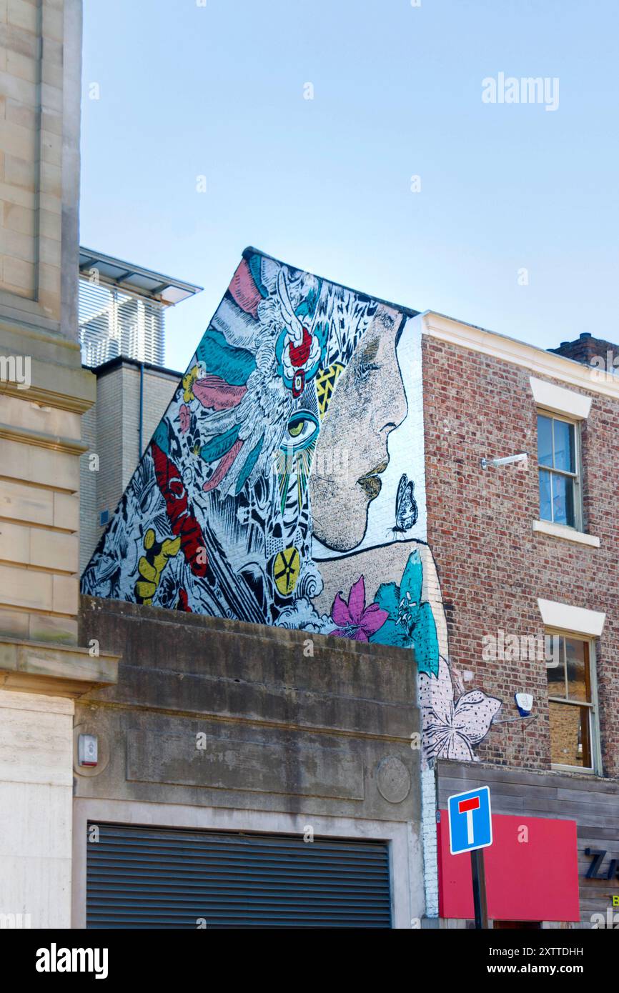 A vibrant urban street scene showcasing a building with colorful ...