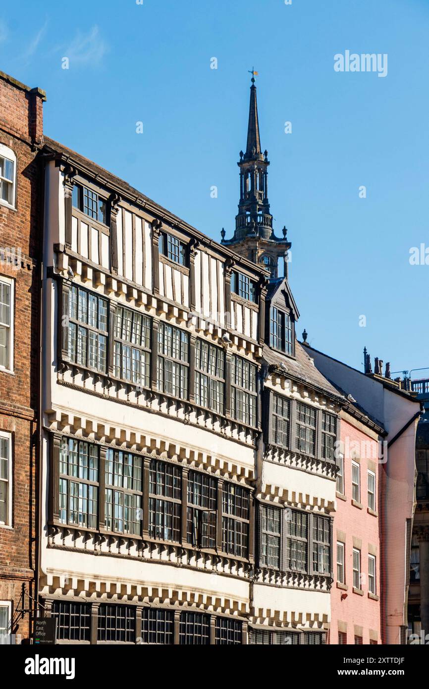 Historic half-timbered buildings with intricate designs and a church ...