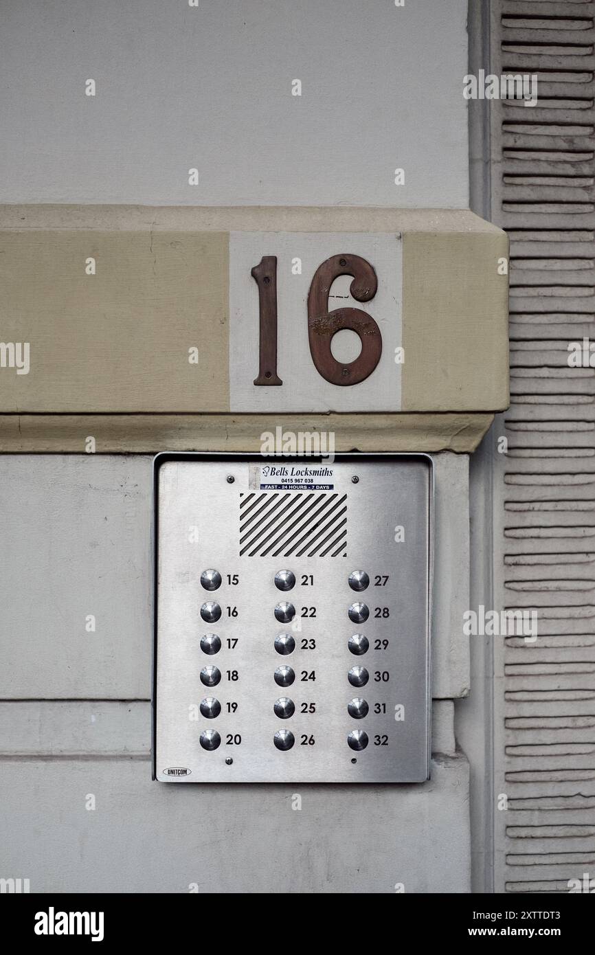 Pointed Intercom Button Apartment block intercom with 32 buttons on a stainless steel plate ...