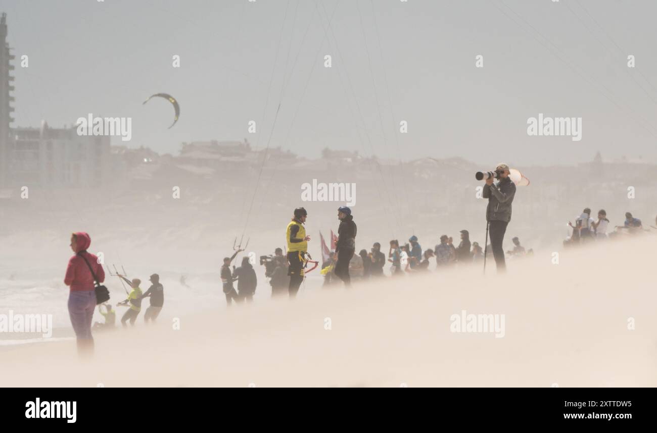 spectators, people, photographers, competitors on a windy Kite beach at ...