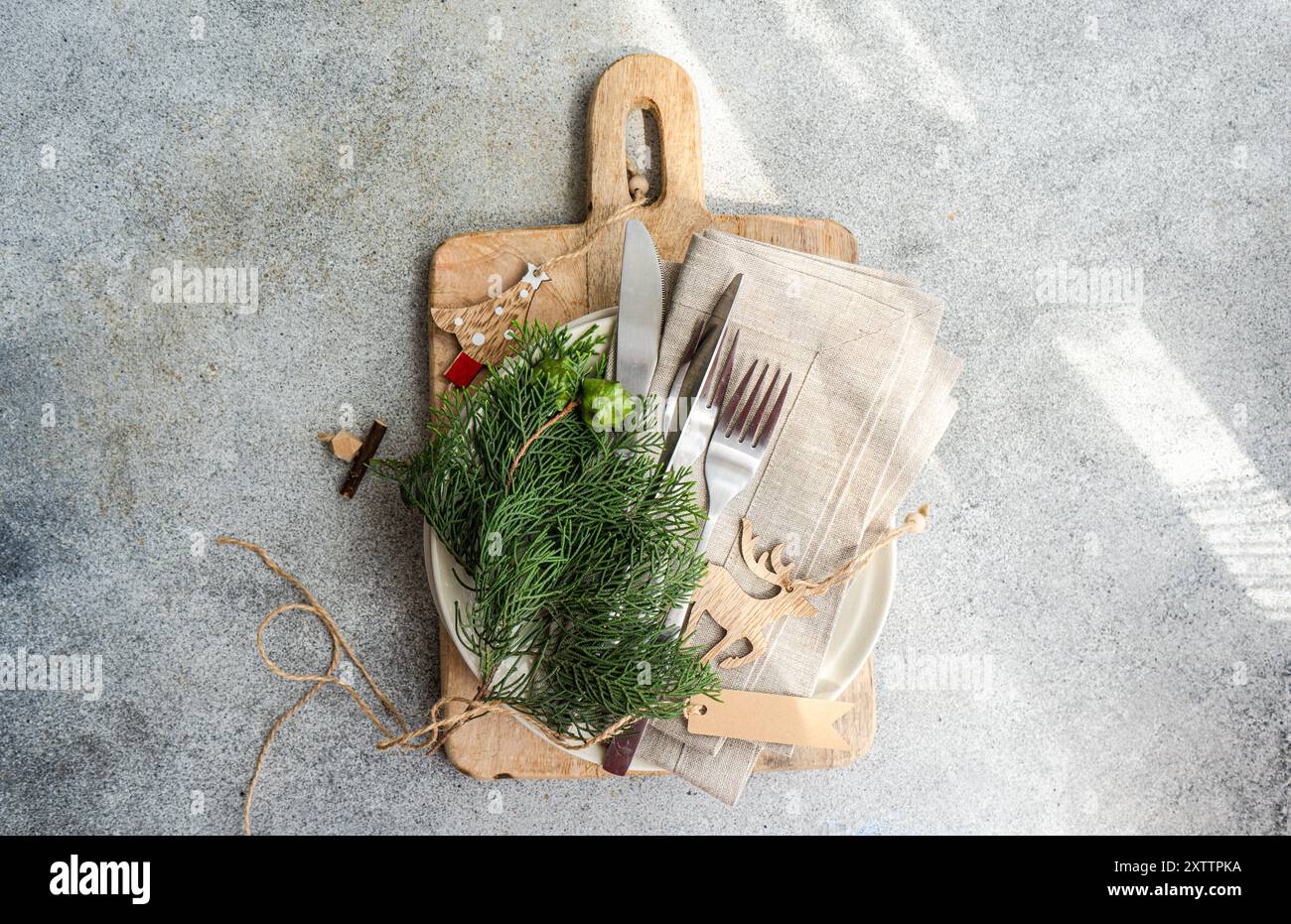 Christmas table setting with fresh thujia Stock Photo