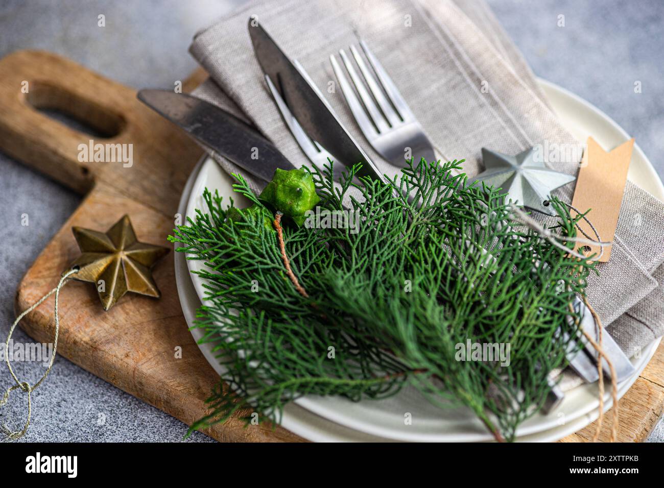 Christmas table setting with fresh thujia Stock Photo