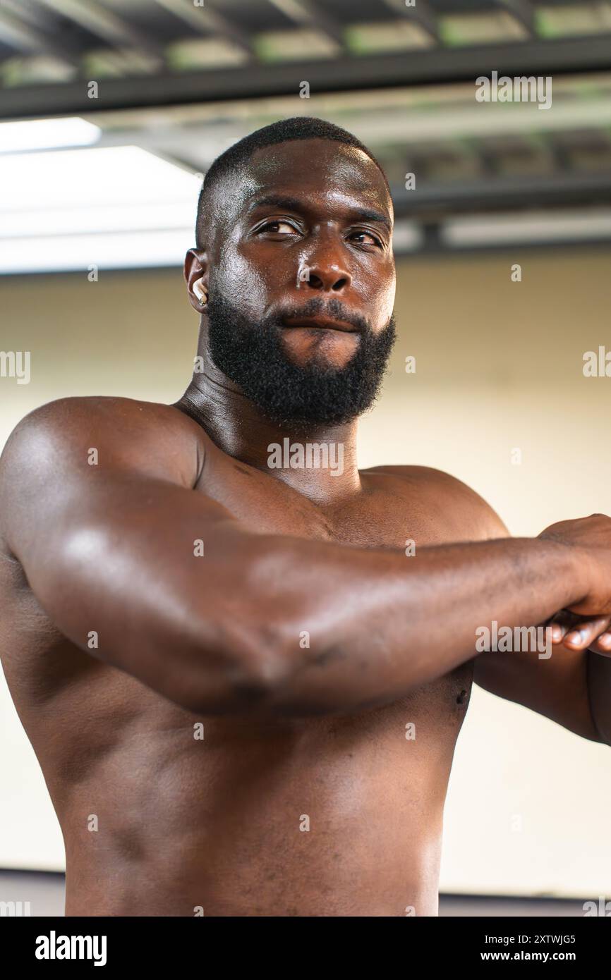 Black man with athletic body getting ready before workout Stock Photo