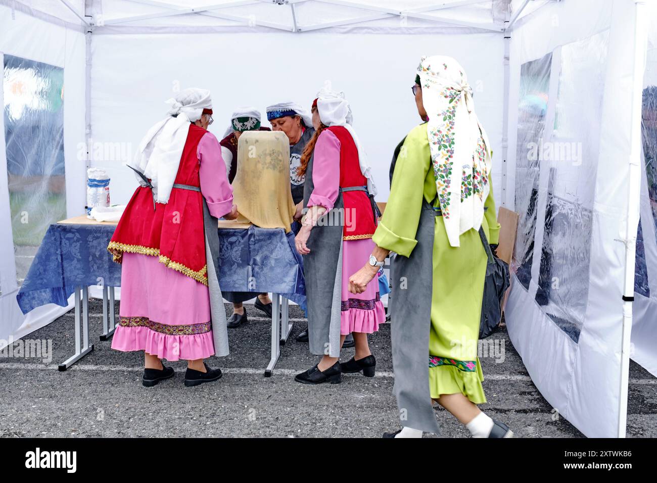 Clothes Making Contest Tobolsk, Russia - July 20, 2024: Asian senior women dressed national ...