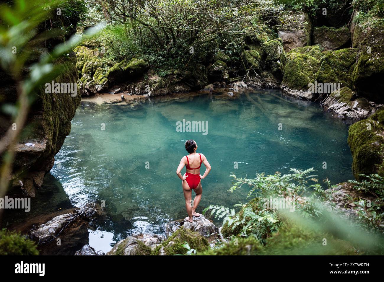 Woman in red swimsuit swimming hi-res stock photography and images - Alamy