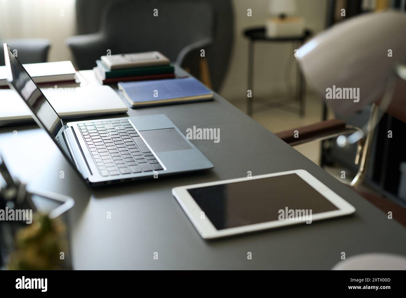 Modern Office Desk Featuring Laptop and Tablet Stock Photo - Alamy