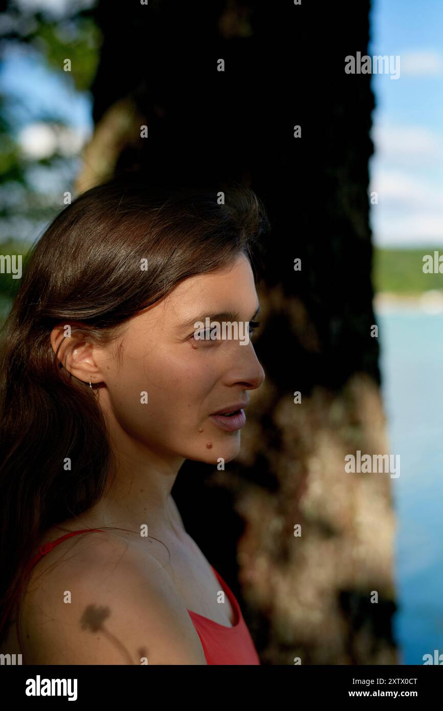 Young woman stands shore gazing hi-res stock photography and images - Alamy