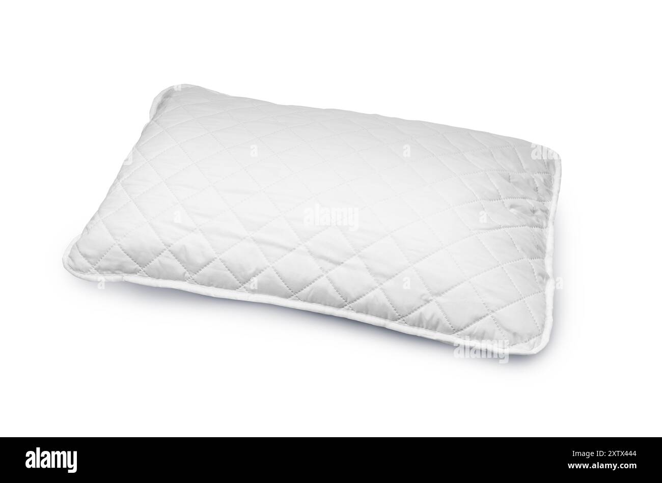 White hypoallergenic pillow in hotel or resort room is isolated on white background with clipping path. Stock Photo