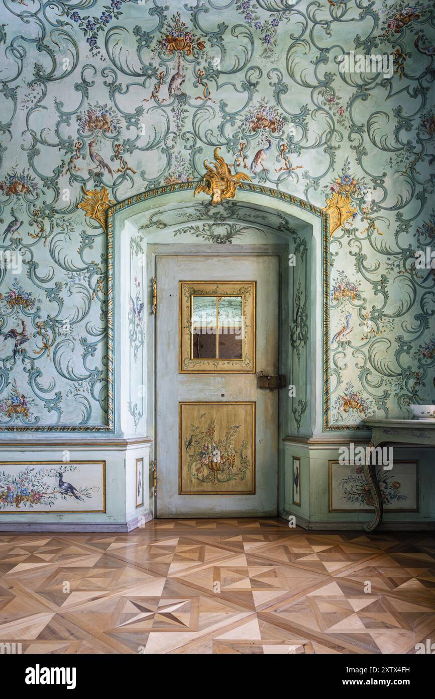Ornamentally decorated wall and artistically painted door in the former ...