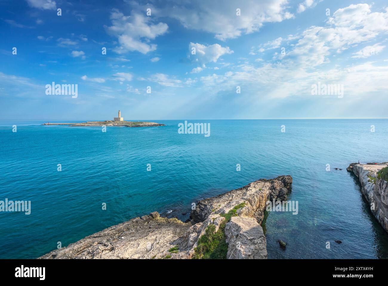 Vieste, rocks and the lighthouse island, Gargano peninsula, Puglia or Apulia region, Italy, Europe. Stock Photo