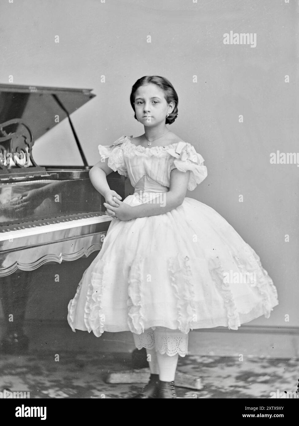 Teresa Carreno (1853-1917) at the age of 8 years with piano - Mathew Brady Studio (attributed) - 1861 Stock Photo