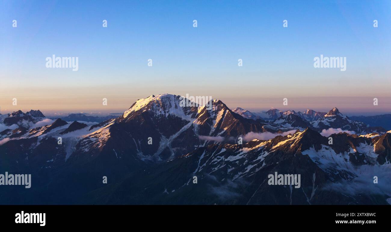 mountain peaks in the rays of dawn, natural landscape Stock Photo - Alamy