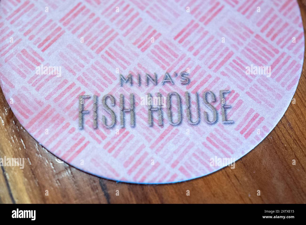USA. 26th July, 2024. Close-up of coaster with logo at Mina's Fish House restaurant at Four Seasons Oahu, Ko Olina, Kipolei, Hawaii, July 26, 2024. (Photo by Smith Collection/Gado/Sipa USA) Credit: Sipa USA/Alamy Live News Stock Photo