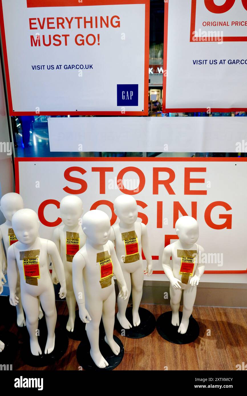 Child sized mannequins being sold off at the front of a closing down ...