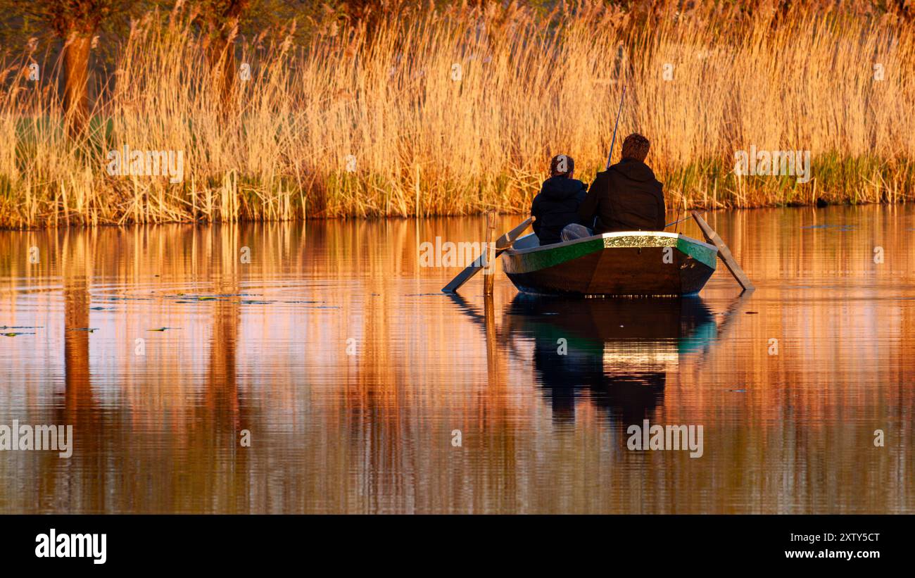 Silhouette father son fishing sunset hi-res stock photography and ...