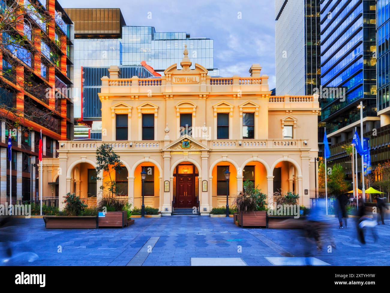 Historic City of Parramatta town hall building at sunset - local government council office surrounded by high-rise modern towers. Stock Photo