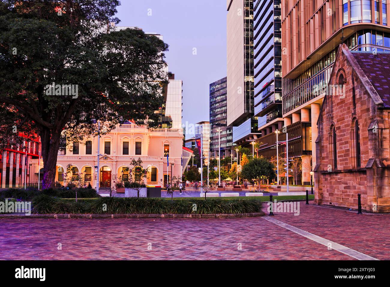 Town Hall and Anglican cathedral around city square in city of Parramatta CBD at sunset in Sydney. Stock Photo
