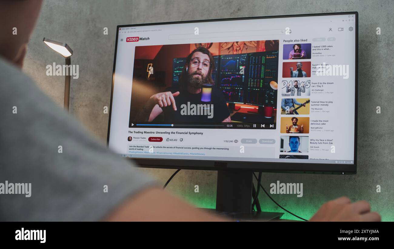 PC monitor shows video sharing platform with blogger content about stock  trading. Teen boy in headphones watches educational video about investment  and cryptocurrency on personal computer at home Stock Photo - Alamy