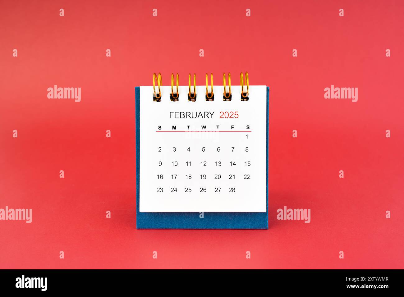 february-2025-white-desk-calendar-on-red-color-background-stock-photo-alamy