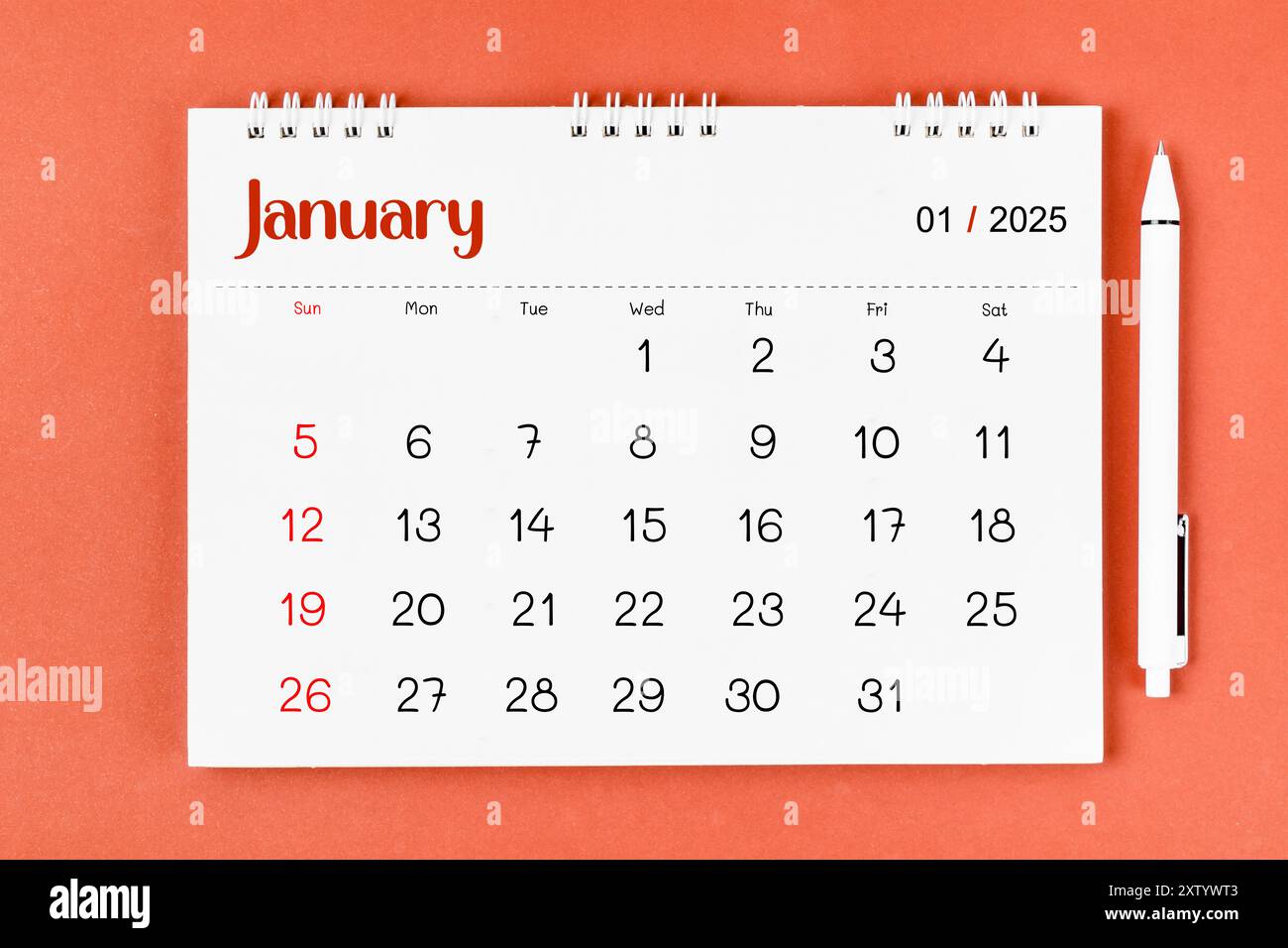 january-2025-monthly-desk-calendar-for-2025-year-and-pen-on-red-background-stock-photo-alamy