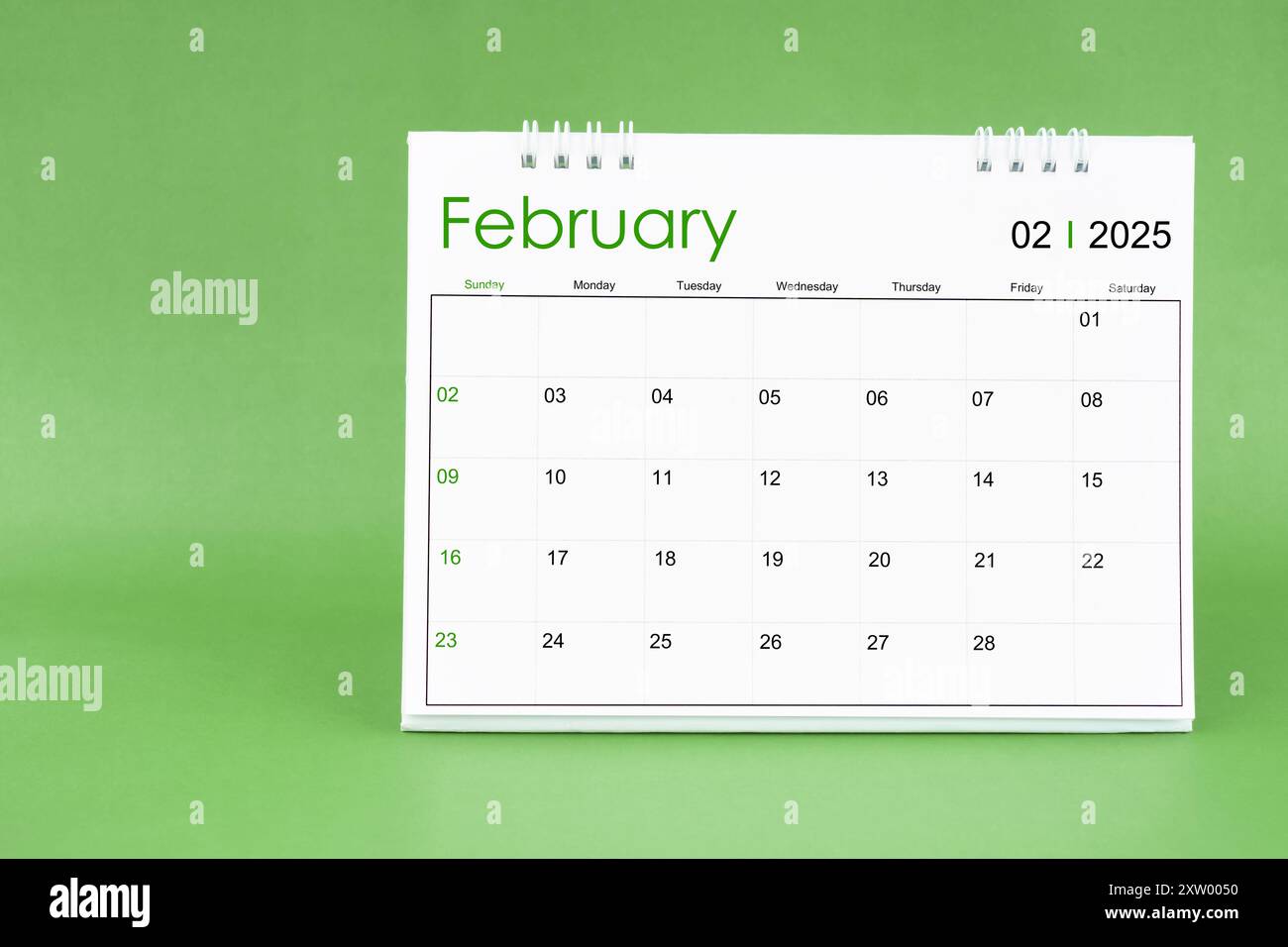February 2025 desk calendar isolated in green color background Stock ...