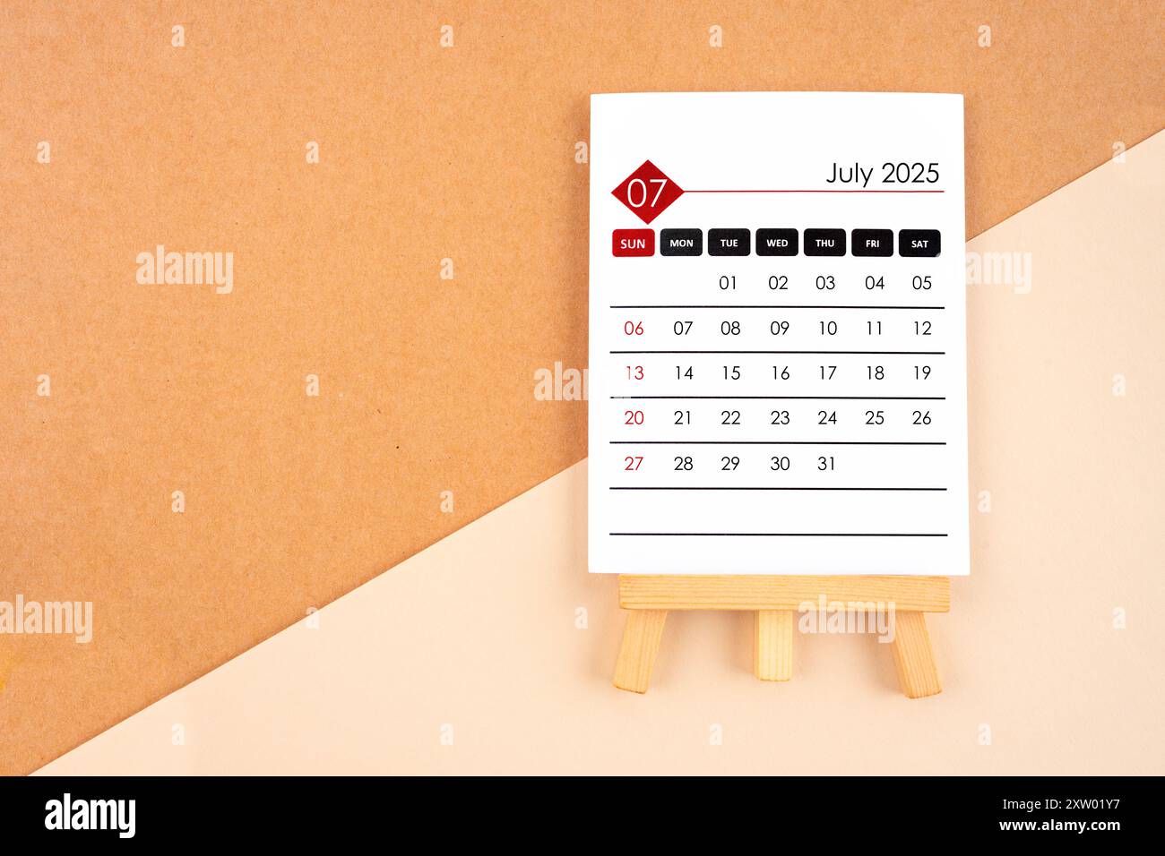 2025-july-calendar-page-on-brown-paper-background-stock-photo-alamy