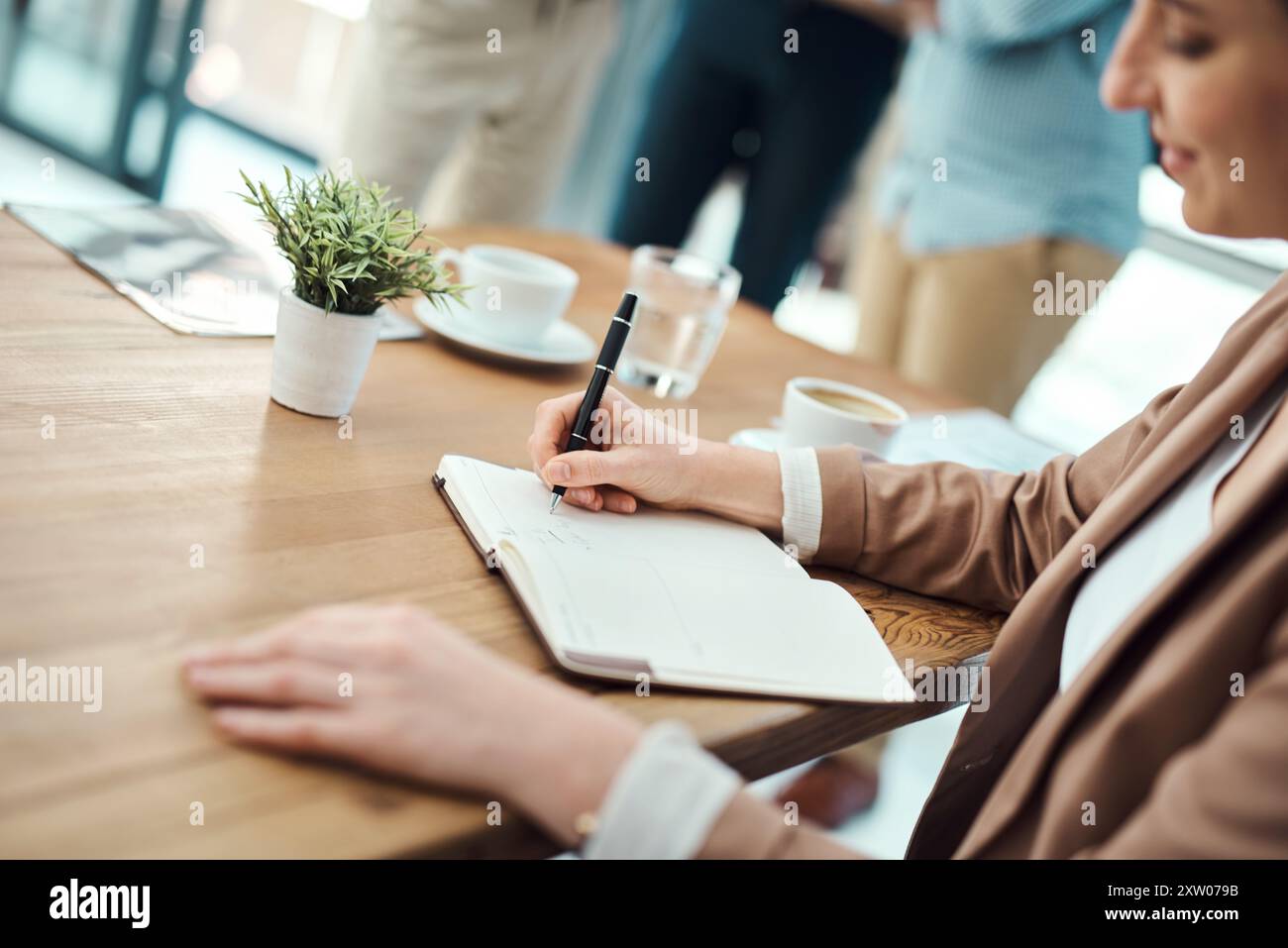 Business, woman and writing in notebook in office for task list ...