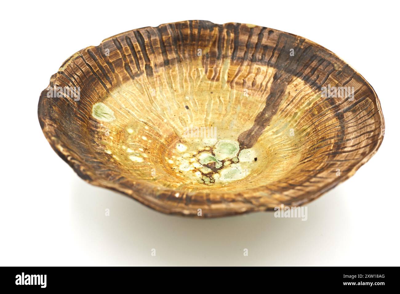 Handmade ceramic plate on white background Stock Photo