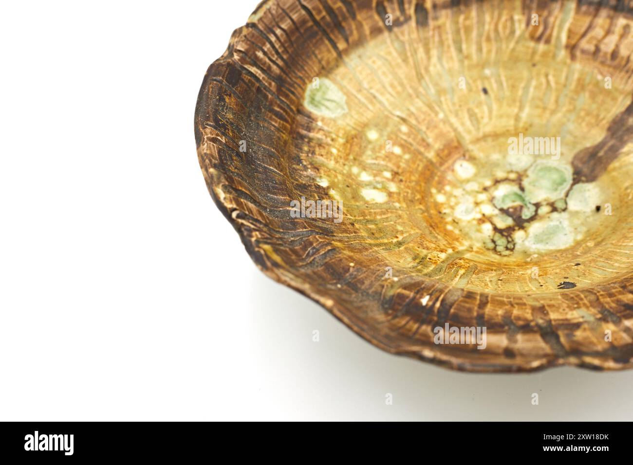 Handmade ceramic plate on white background Stock Photo
