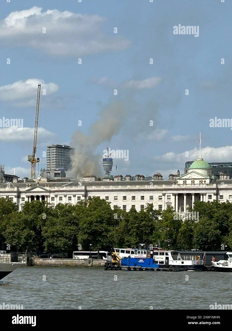 Handout photo taken with permission from the social media site X, formerly Twitter, posted by @michelleeb of smoke coming from the roof of Somerset House on The Strand in central London. London Fire Brigade said: "Ten fire engines and around 70 firefighters have been deployed to a fire at Somerset House". Issue date: Saturday August 17, 2024. Stock Photo