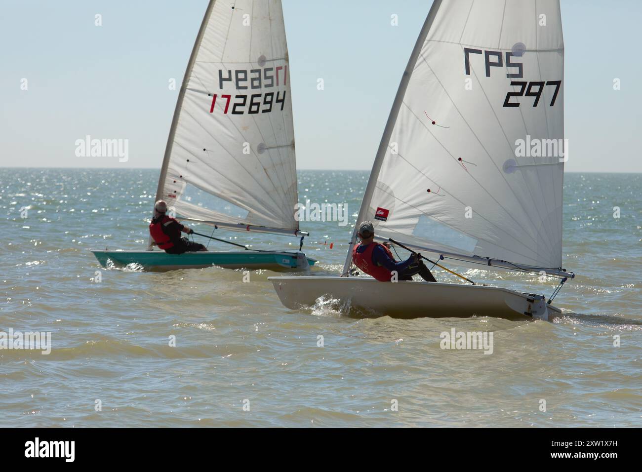 Local sailing enthusiatsts enjoying dinghy racing at Hythe,Kent,UK ...