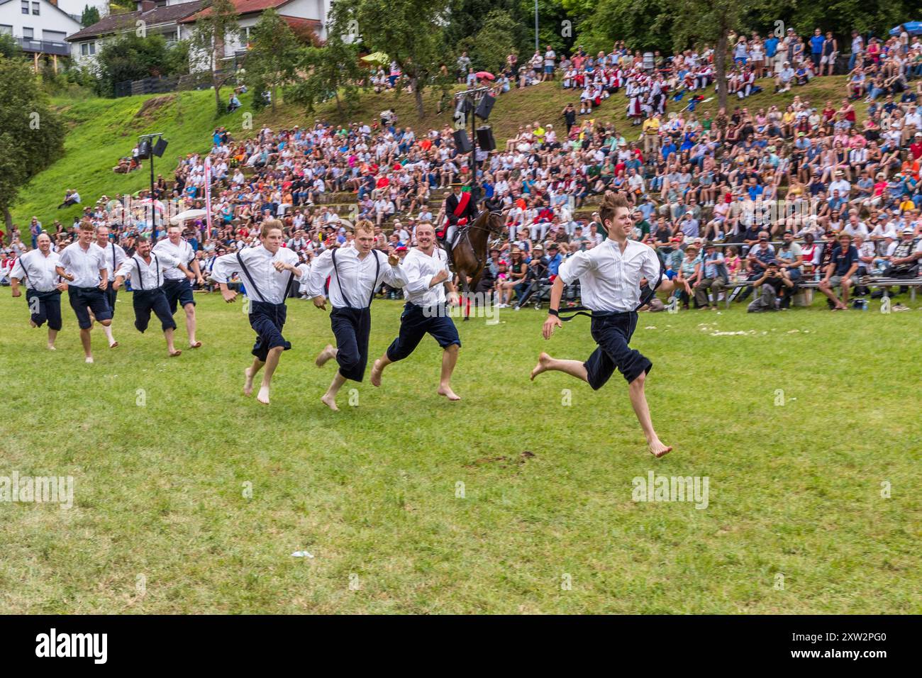 The highlight of the traditional festival in Wildberg is the shepherd's run. The young men, who must all come from shepherd families, run barefoot for the title of Shepherd King. Finish line at the Schäferlauf 2024 in Wildberg. Klosterhof, Wildberg, Baden-Württemberg, Germany Stock Photo