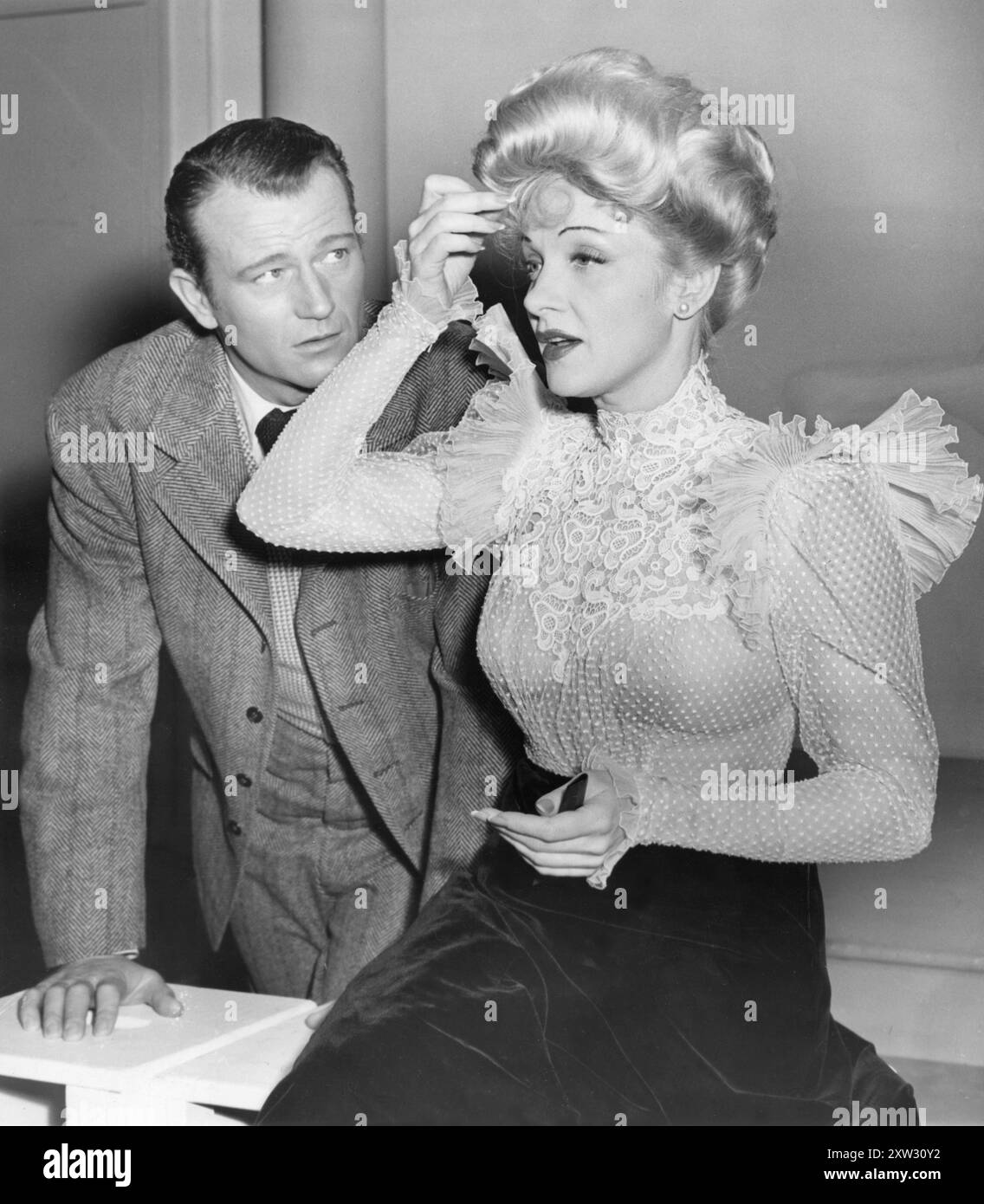 John wayne and marlene dietrich photographed during the making of the