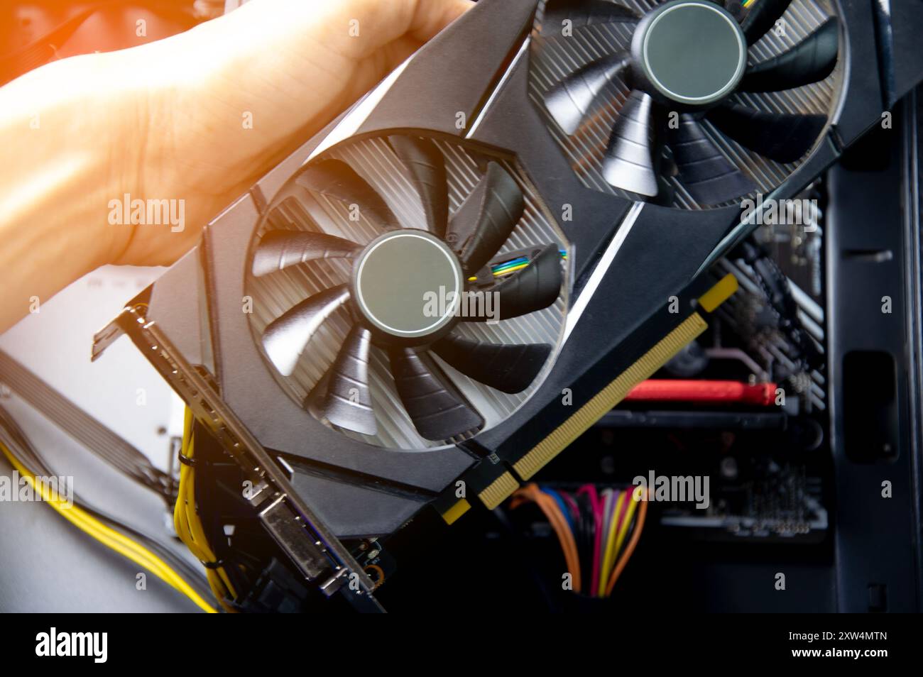 Technician repairing computer Change the graphics card in the computer. Stock Photo