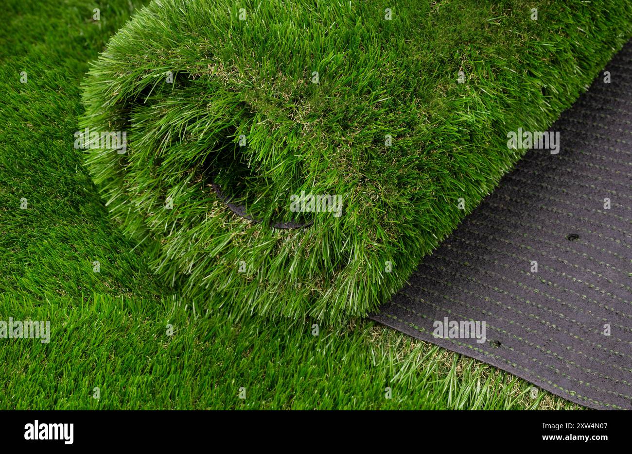 Rolled Artificial Grass Carpet on Display Stock Photo