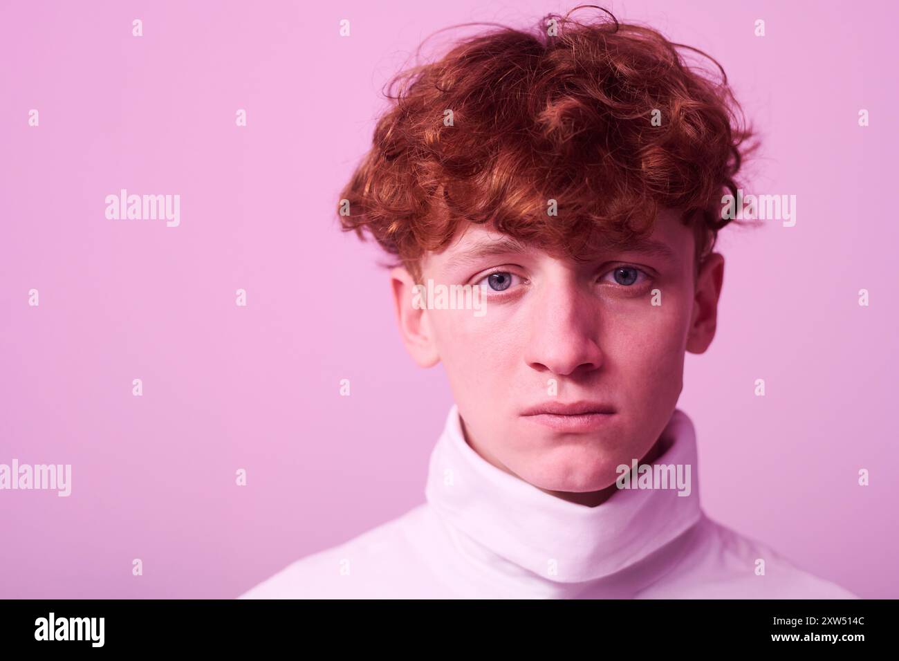 Portrait of Young Man with Curly Red Hair Wearing Turtleneck Stock