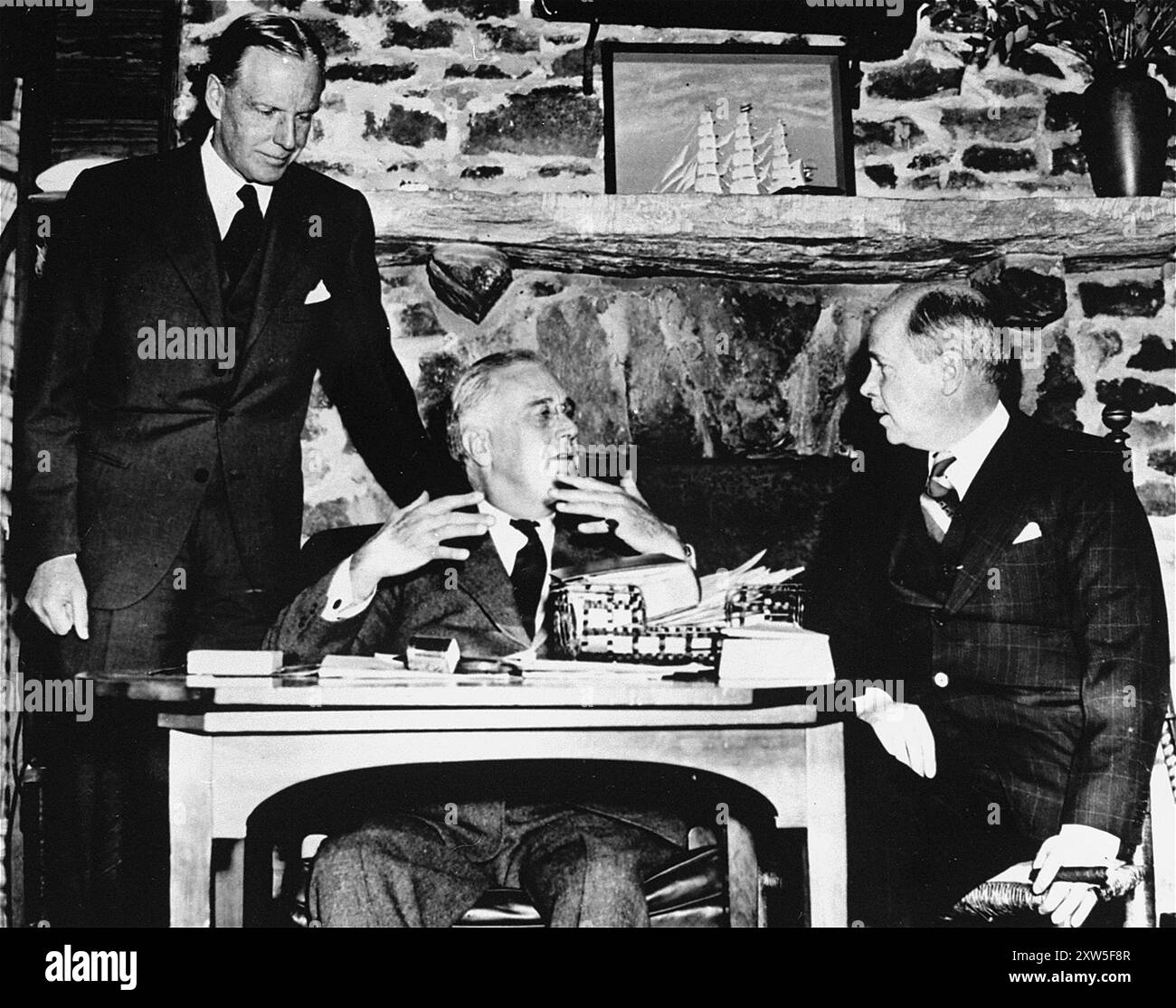 President Roosevelt with the American ambassador to Italy William Phillips (left),  and the Ambassador to Germany Hugh Wilson (right). The phto was taken at Warm Springs in Georgia (USA) on 29th November 1938. This was just a couple of weeks after Kristallnacht and was the time when Roosevelt knew that the USA had to get involved and had to persuade the people of this. Stock Photo