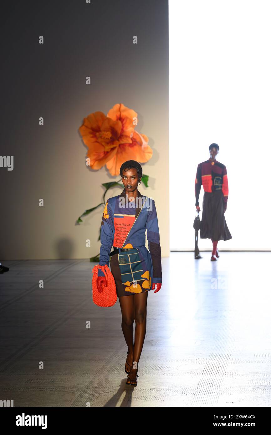 London, UK, 16th August 2024, Fashion In Motion, Orange Culture by Nigerian fashion designer Adebayo Oke-Lawal was on show at the Victoria & Albert Museum. The designs feature pieces that spring from a holistic approach to design, which addresses themes of identity, belonging and sustainability. Fashion In Motion is a free catwalk show which takes place in a museum setting., Andrew Lalchan Photography/Alamy Live News Stock Photo